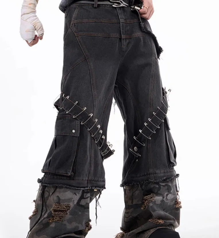 Men's grey and camouflage colour-block jeans with a structured pin and ribbon detail.