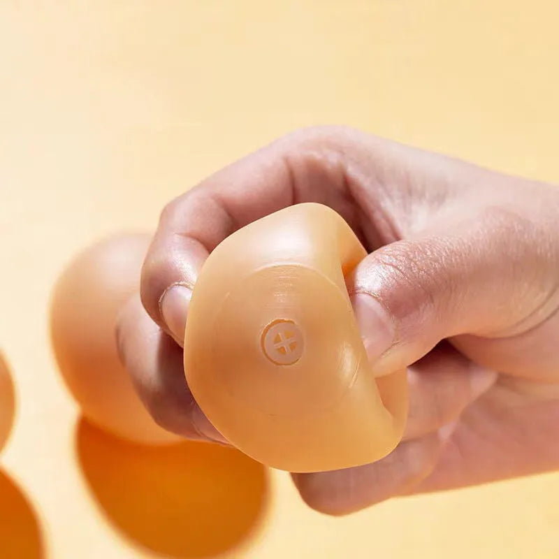 Egg-shaped dog squeaky toy for dental cleaning with sound mechanism