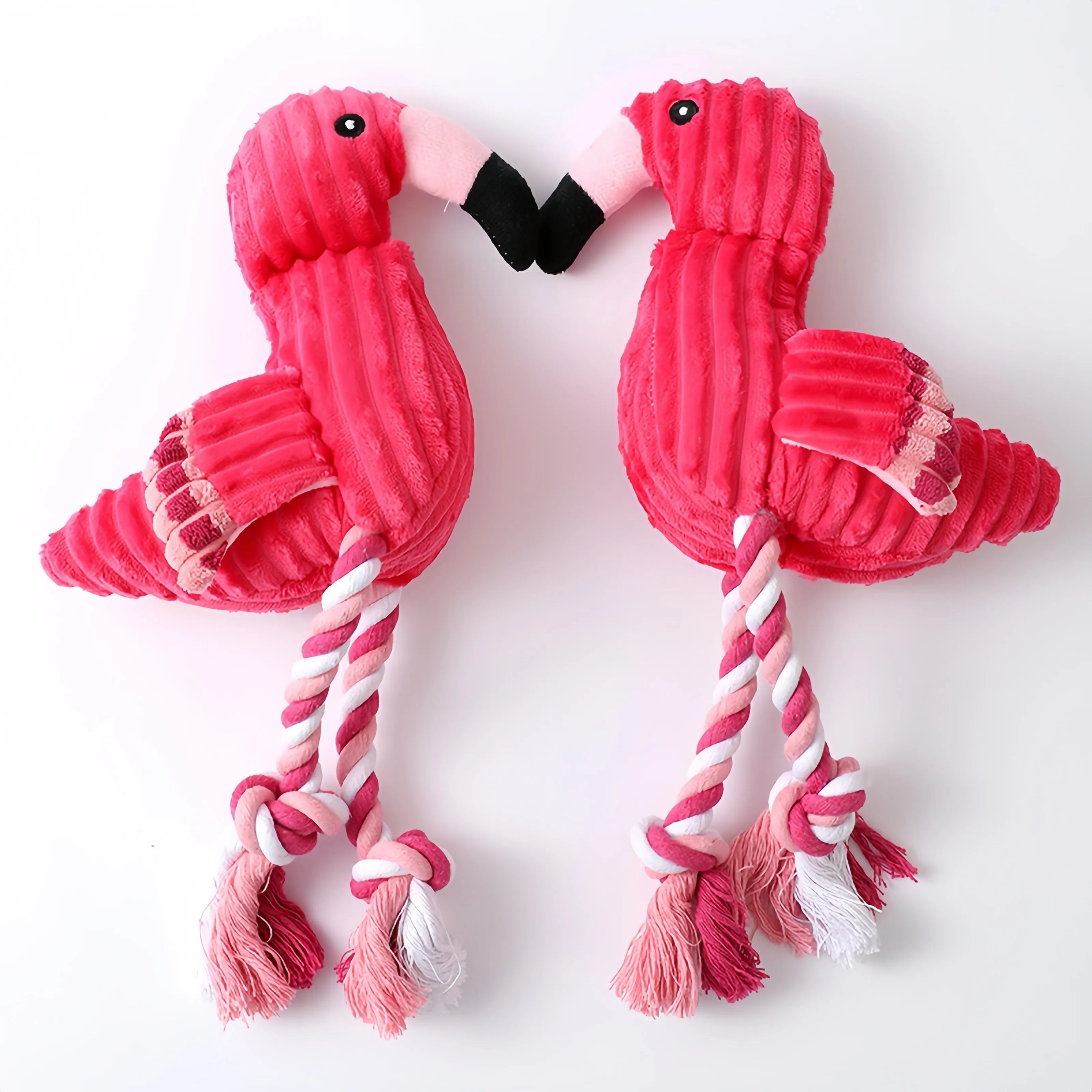 Pink animal-shaped plush dog toy with corduroy fabric and internal squeaker for small and large breed dogs