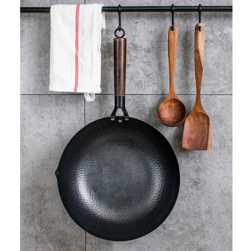 Traditional black iron wok with wooden handle showing 40cm diameter and flat induction base