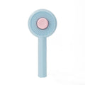 Blue and yellow pet grooming brush with metal pins and a self-cleaning button