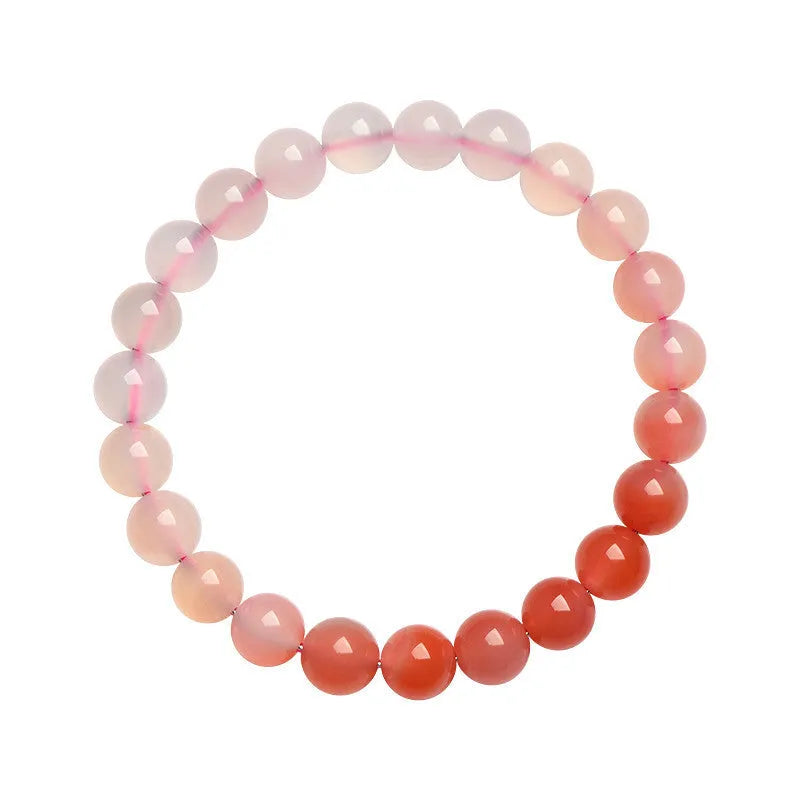 Natural gradient Yanyuan agate bracelet with geometric beads in salt source colour on a wrist.