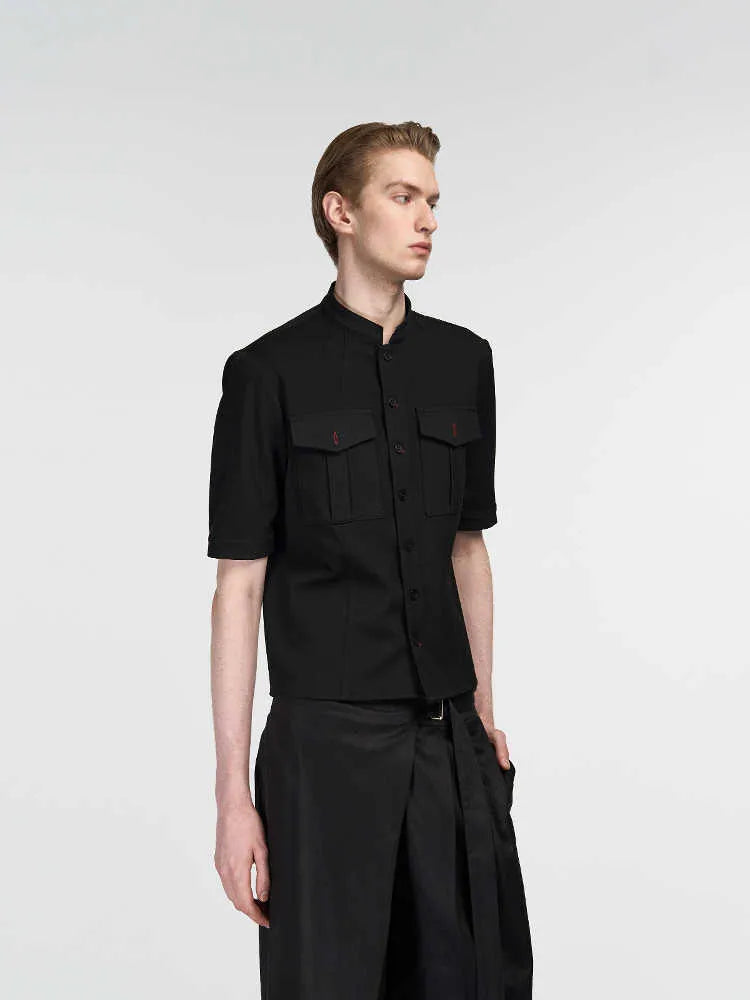 Handmade black half-sleeve hunting shirt with a shirt collar on a mannequin