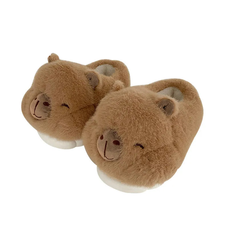 Light brown women's plush winter slippers with a round toe and slip-on design on a white background.