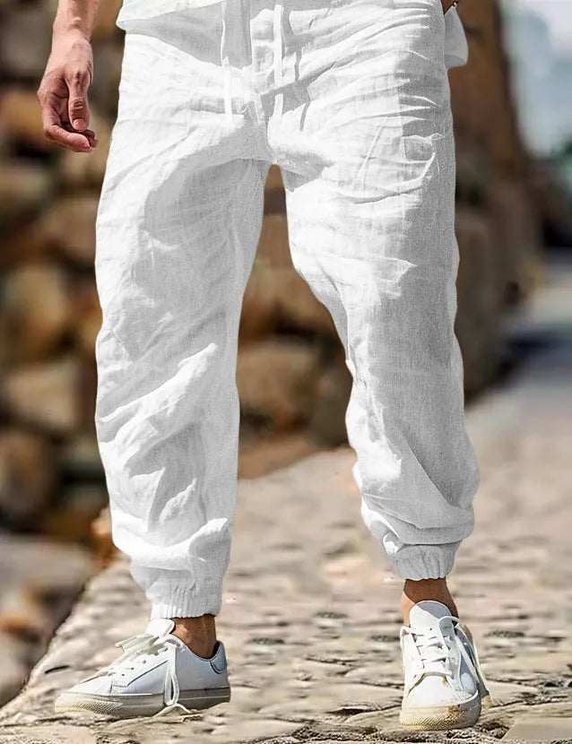 Men's straight-leg cotton trousers in apricot colour with an elastic waistband.