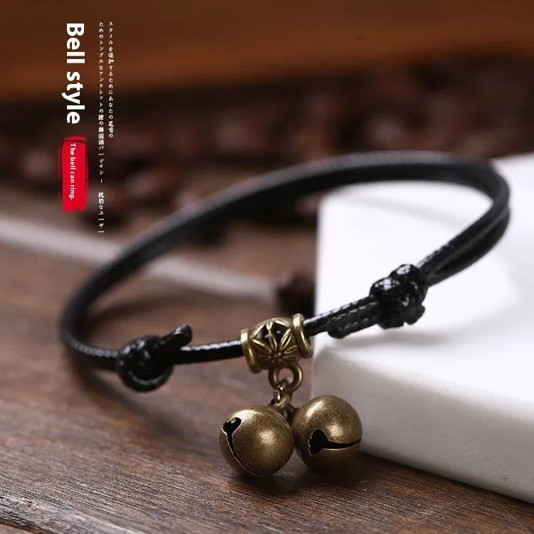 Small dog nylon rope collar with brass bell shown in black, red, and coffee colours.