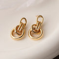 Gold geometric copper earrings with irregular shape and simple pierced design