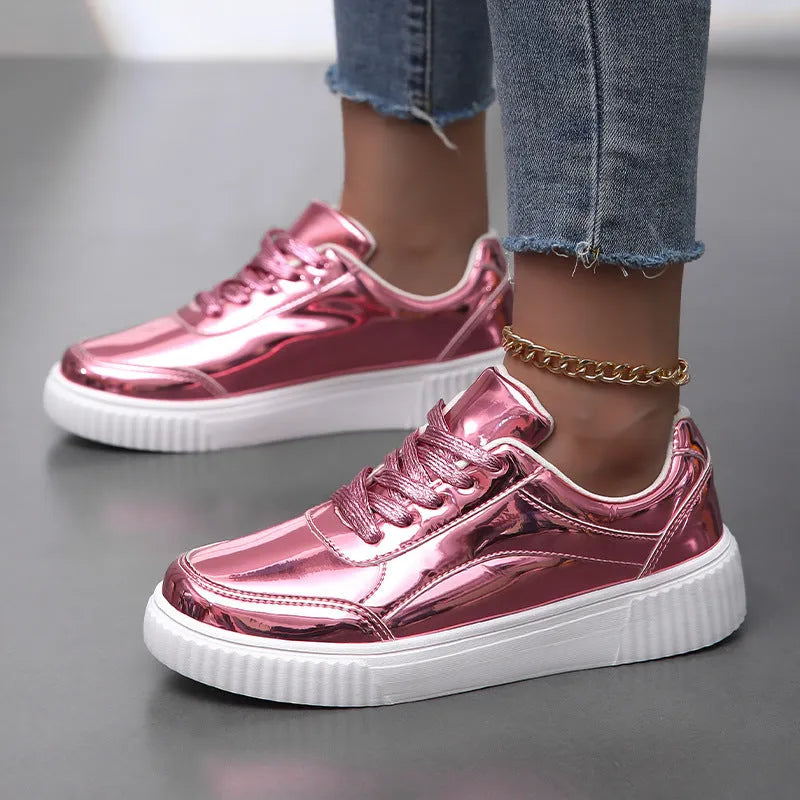 Rose gold sequinned platform sneakers with round toe and thick sole on a white background