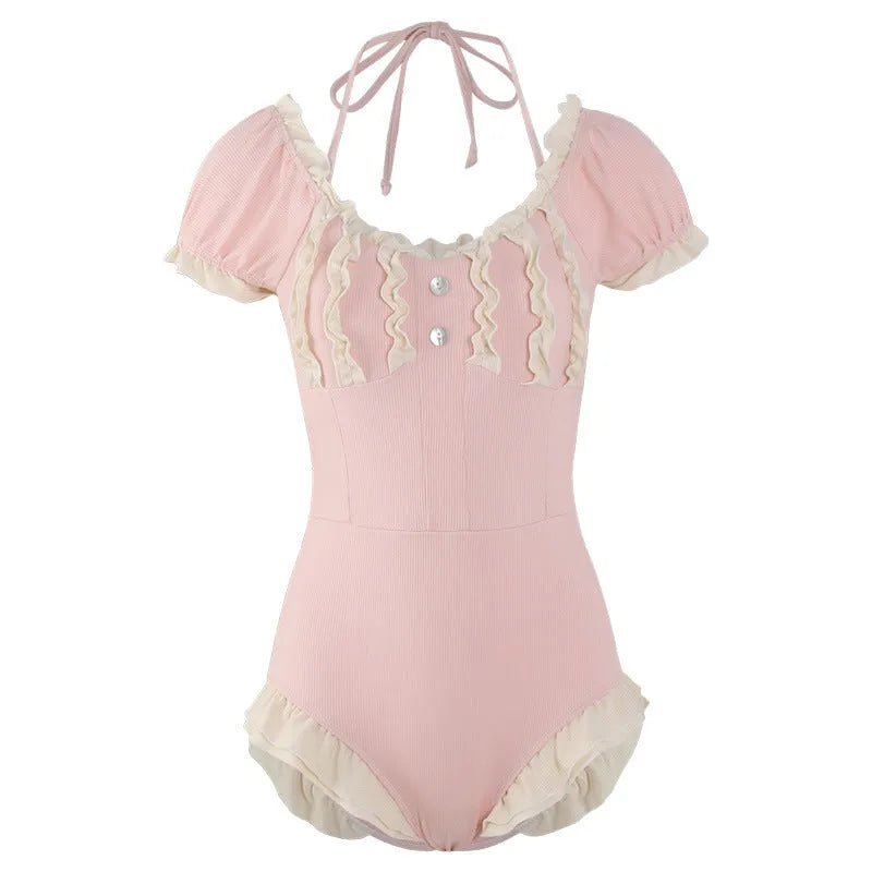 Women's pink conservative one-piece swimsuit made from nylon fabric