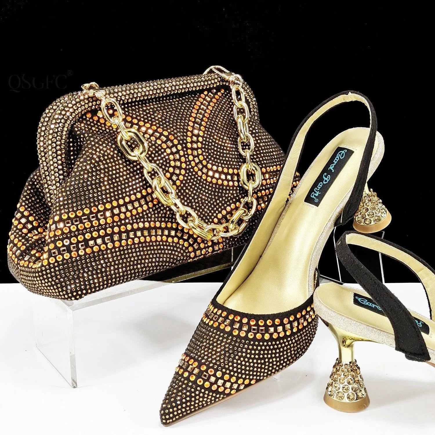 Women's pointed-toe high heel shoes with matching bag, featuring a stiletto heel and rhinestone detail on a synthetic leather upper.