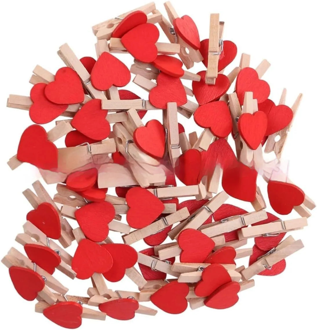 Five small solid wood heart-shaped clips in different colours showing handmade craft details