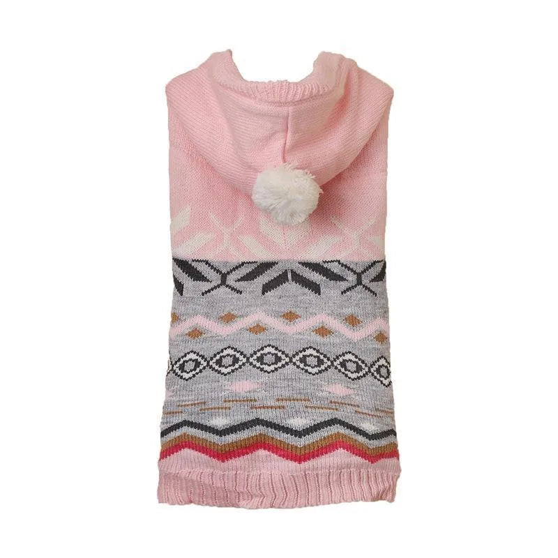 Green diamond pattern knitted acrylic sweater on a small dog, showing ribbed cuffs and classic knit design.