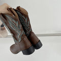 Brown women's embroidered mid-calf Martin boots with a round toe and low square heel.