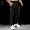 Men's waterproof quick-dry workout trousers in nylon fabric for sports and fitness