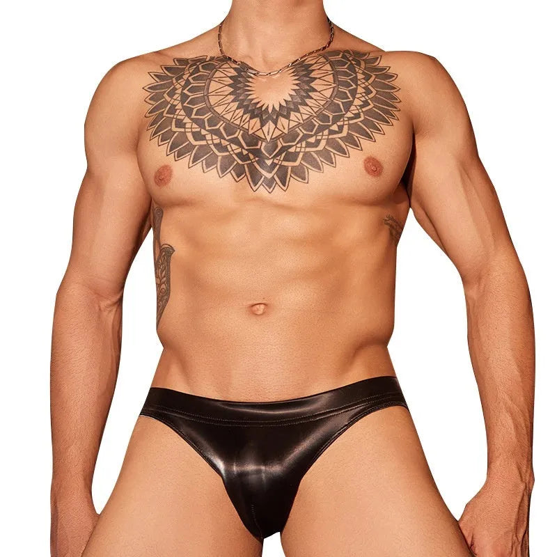 Men's black shark skin lace hip briefs showing textured fabric and hip-hugging fit