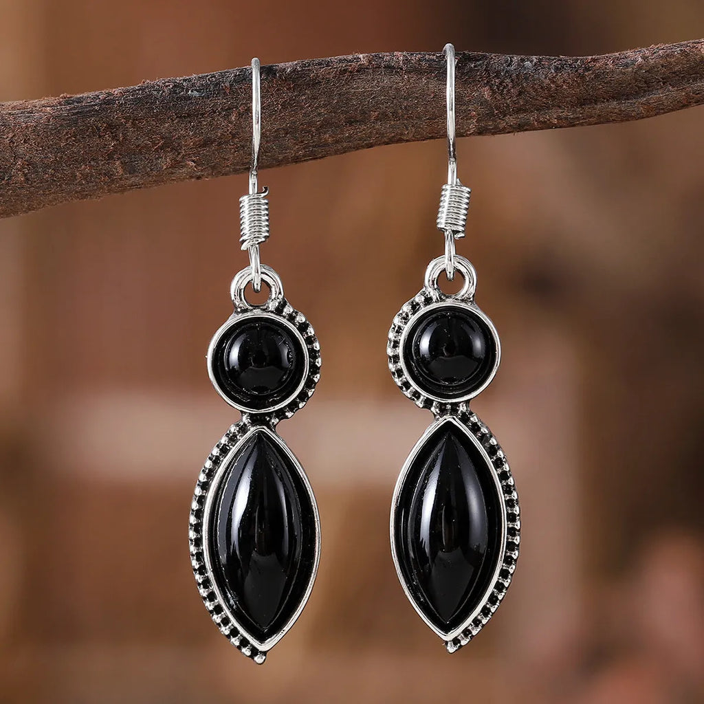 A pair of black and purple geometric vintage pendant earrings with a round detail, made from zinc alloy.