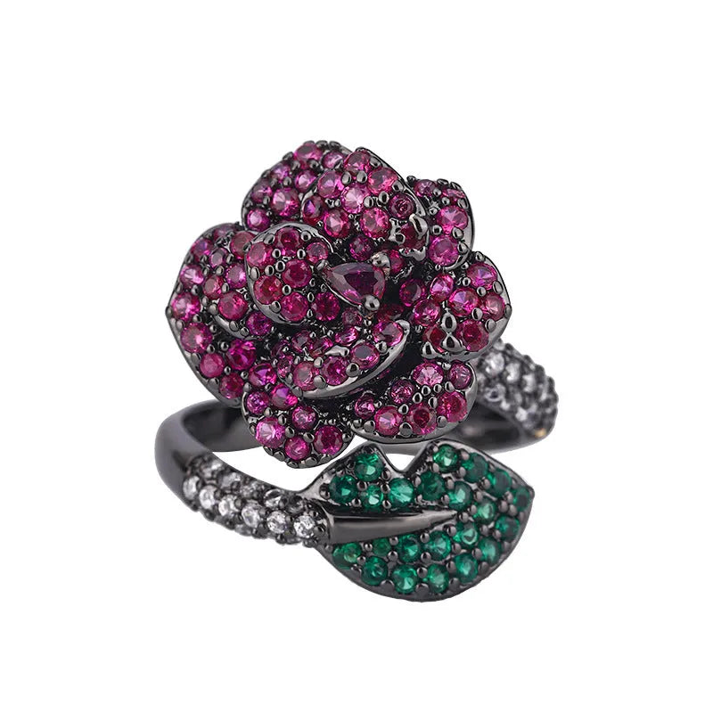 Geometric black gold women's ring with simulated red corundum stones