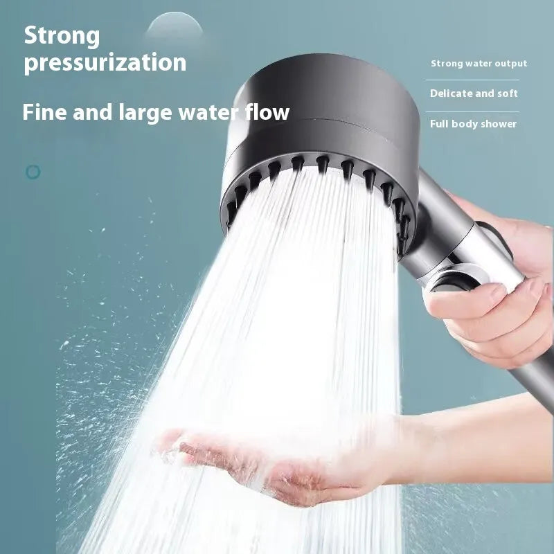 Portable white ABS shower head with three-gear dial for spray, massage, and rain functions.