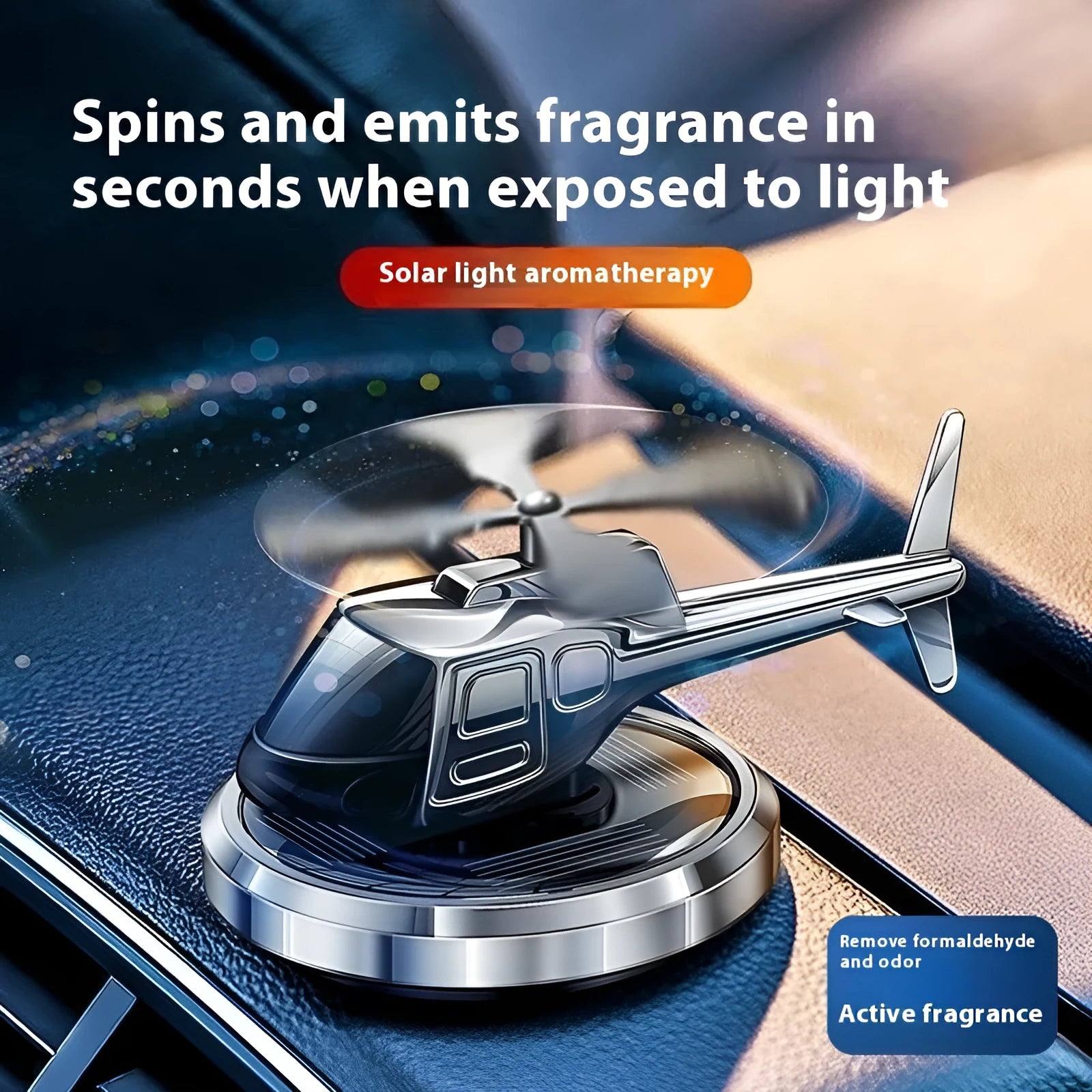Silver metal helicopter car air freshener with rotating blades on dashboard