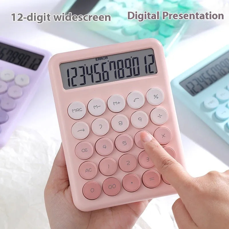 Dopamine gradient colour desk calculator in violet, pink, blue, and mint green on a desk.