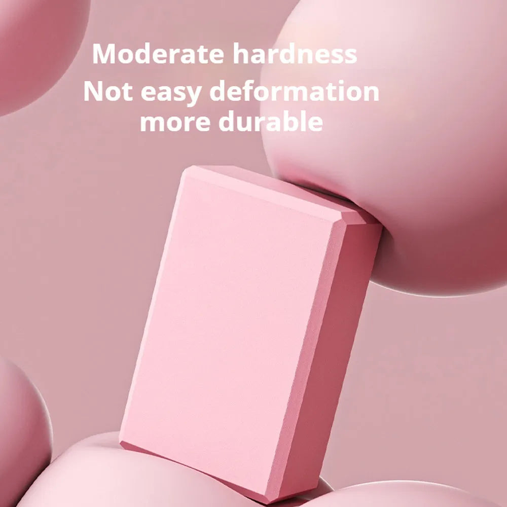 Solid colour EVA foam yoga block showing hexagonal facets and grip ridges