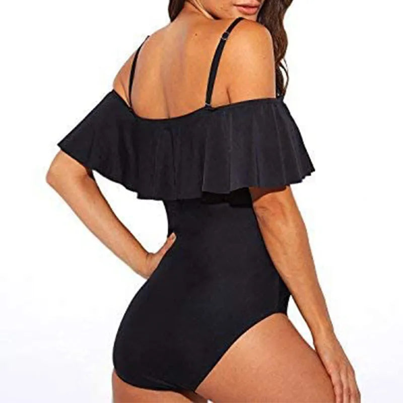 Black one-piece swimsuit with cut-out design and ruffled tube top style straps