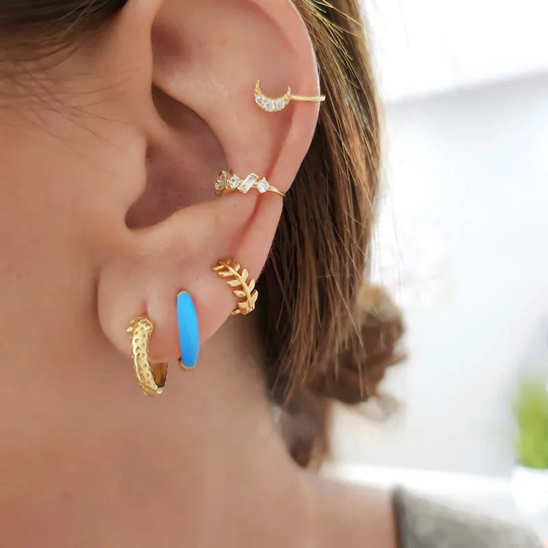 Geometric U-shaped oval epoxy earrings in dripped oil colours on copper wire.