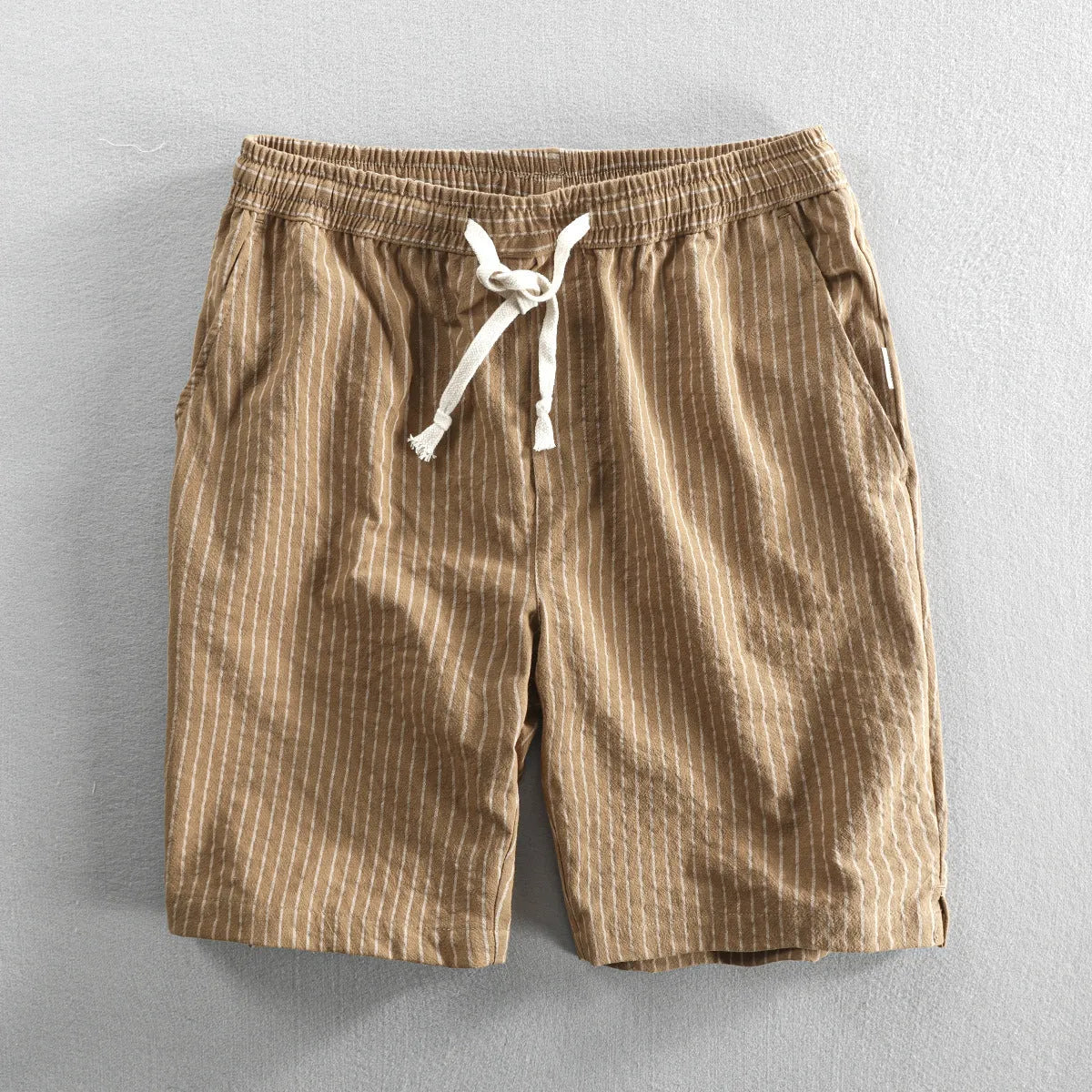 Men's striped cotton casual shorts showing straight-leg design and mid-waist fit