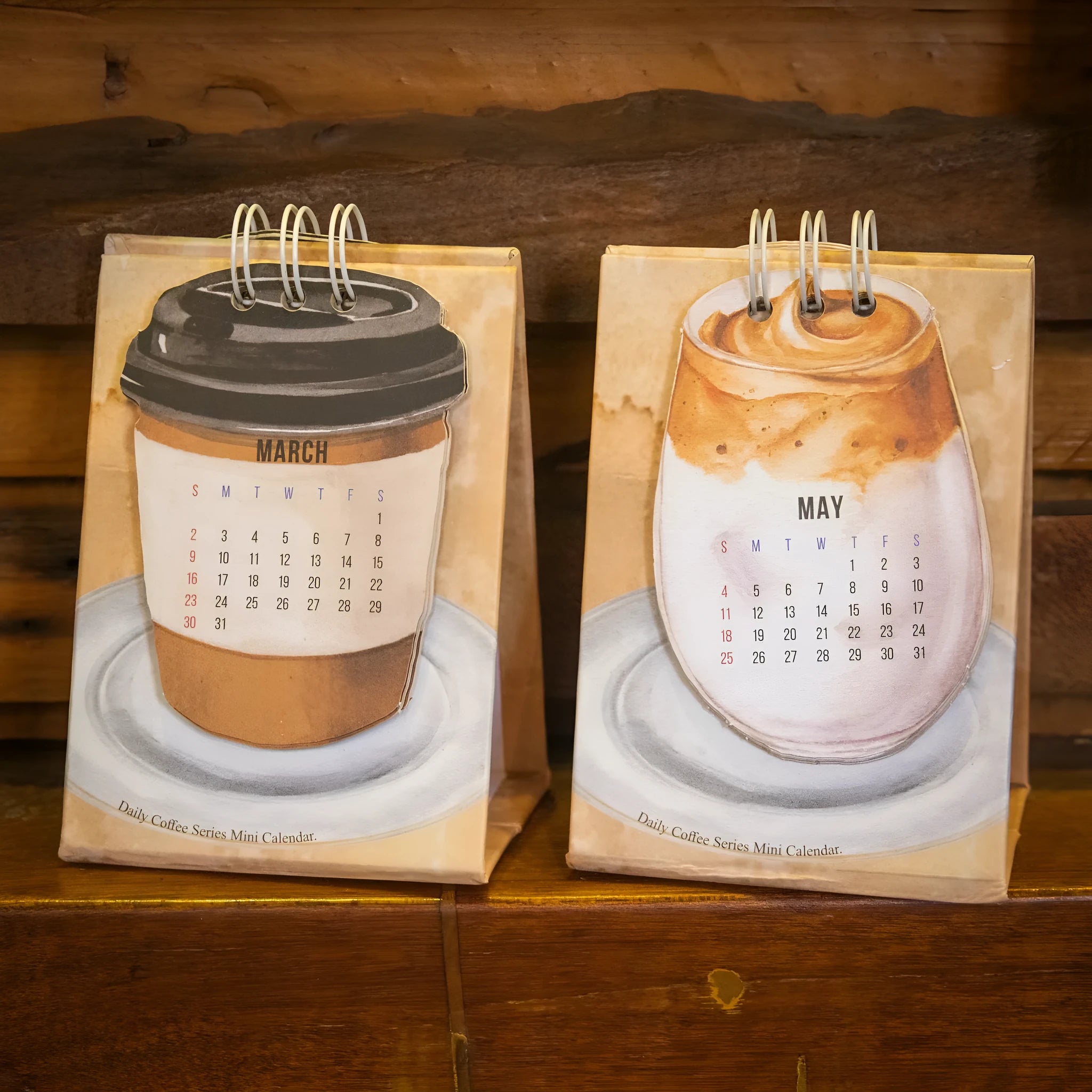 Mini A5 desk calendar 2025 showing one of eight themed designs in simple modern style