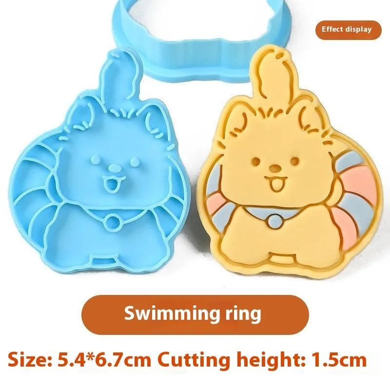Three dimensional plastic biscuit mold showing puppy head and birthday hat designs