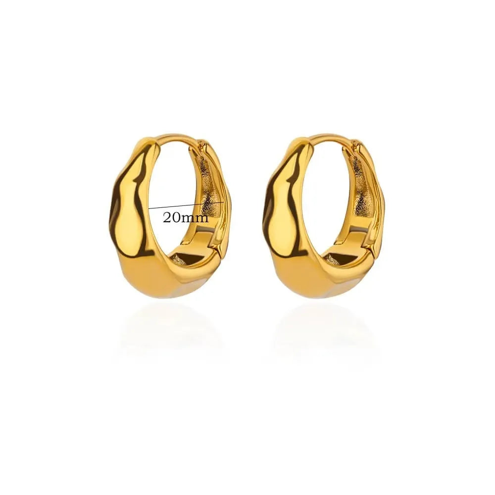Geometric butterfly-shaped earrings with heart, bow, and star details in copper with a diamond-cut finish.