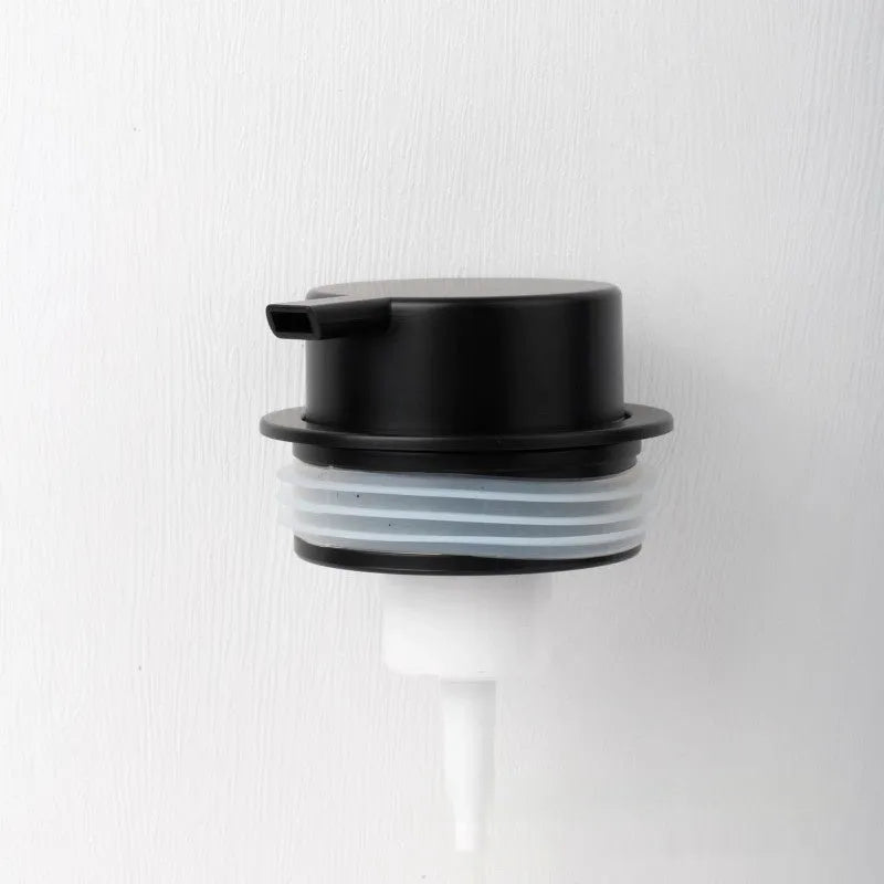 ABS plastic foam pump dispenser with large metallic push head in matte black finish.