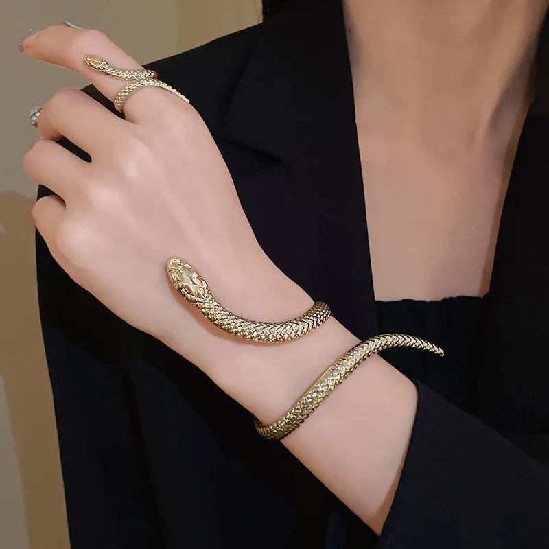 Gold twisted snake design ring and bracelet jewellery set with exaggerated winding metal construction