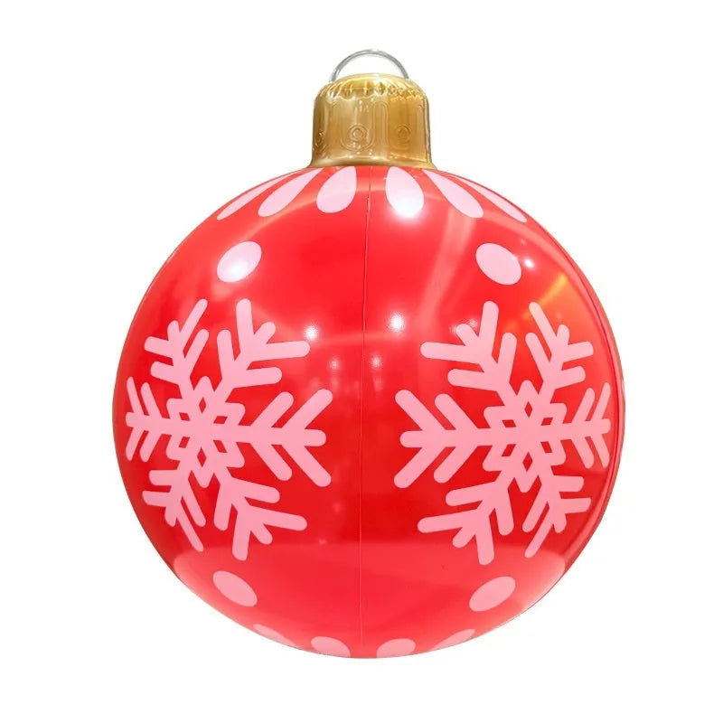 Large inflatable Christmas ball decoration with LED lights in garden setting