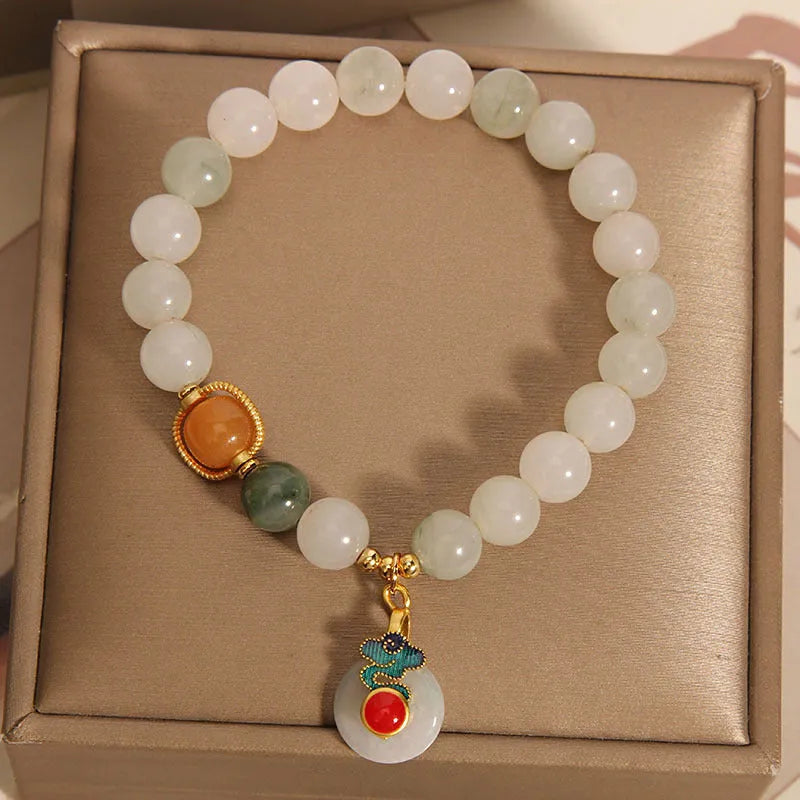 Women's ice jade and pearl bracelet with a retro-styled peace jade buckle.