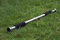 Steel adjustable pull-up bar extended for doorframe installation, showing parallel grips.