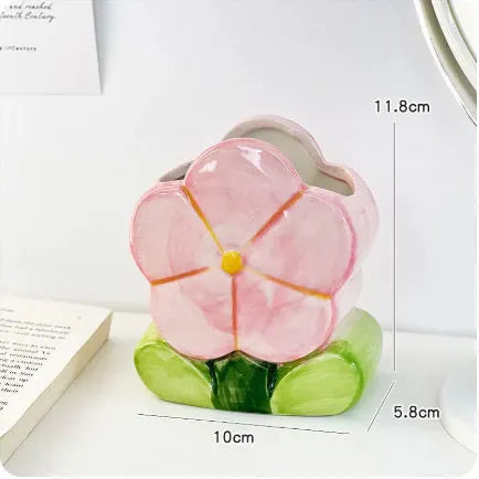 Ceramic flower pen holder storage box with floral pattern on desktop
