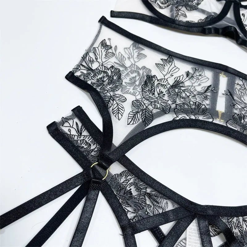 Black lace mesh three-piece set with floral print showing V-neck top, high-waisted pants, and waist ring