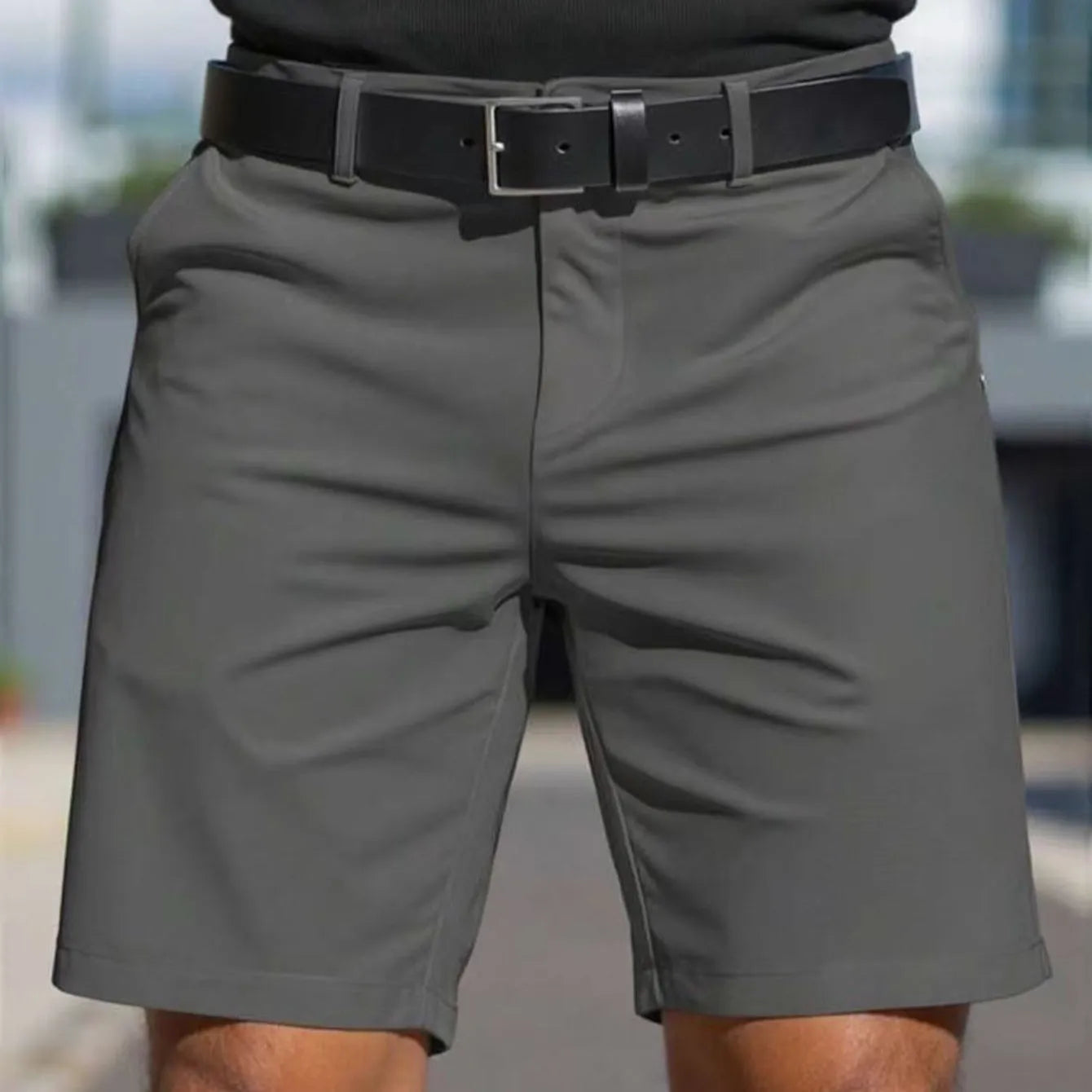 Man wearing straight-leg micro-elastic polyester fifth pants shorts in a choice of nine colours.