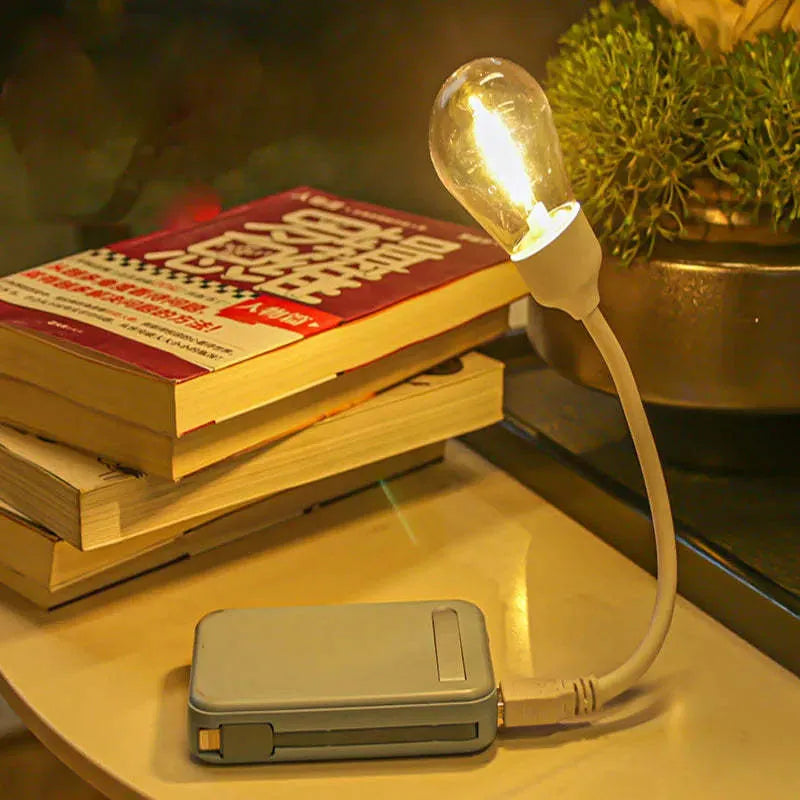 USB rechargeable folding night light with tungsten S14 bulb showing warm white illumination
