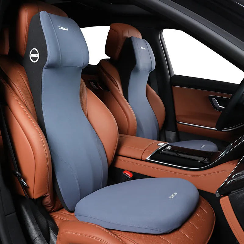 Integrated automotive memory foam seat cushion and headrest lumbar support pillow in various colours.
