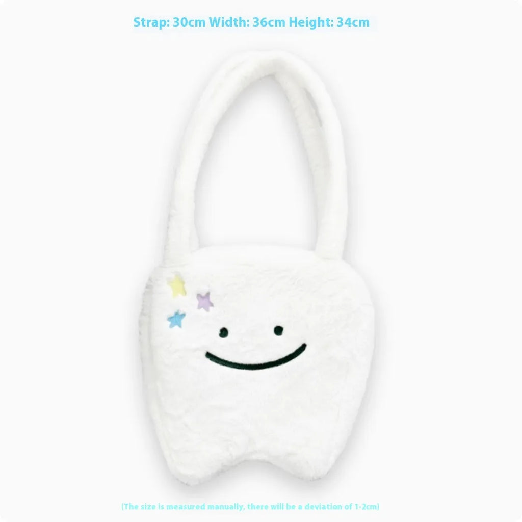 White plush large tooth shoulder tote bag with crossbody strap and zipper.