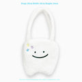 White plush large tooth shoulder tote bag with crossbody strap and zipper.
