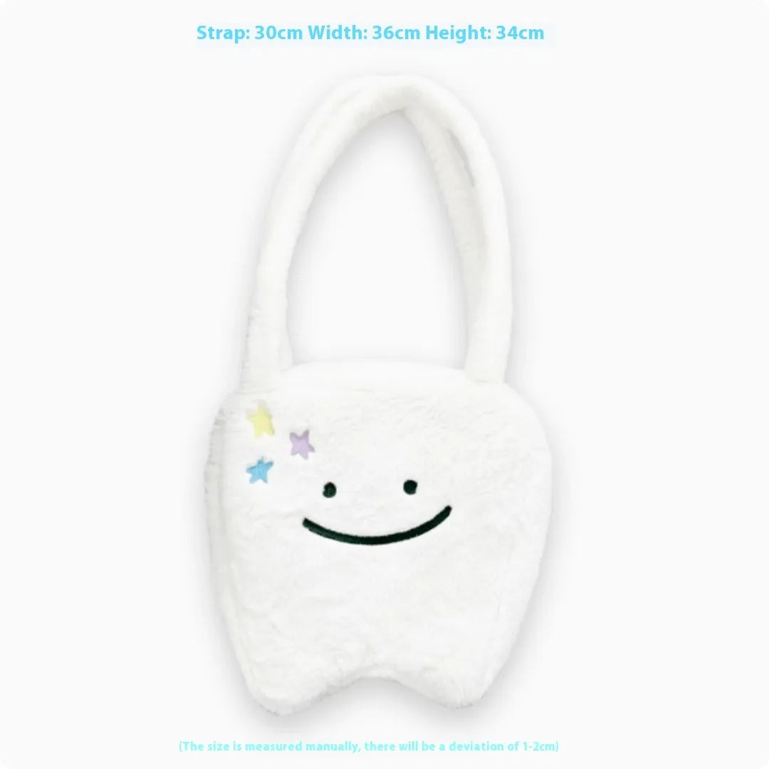 White plush large tooth shoulder tote bag with crossbody strap and zipper.