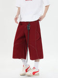 Retro denim workwear shorts with wide leg design and multiple pockets in black colour