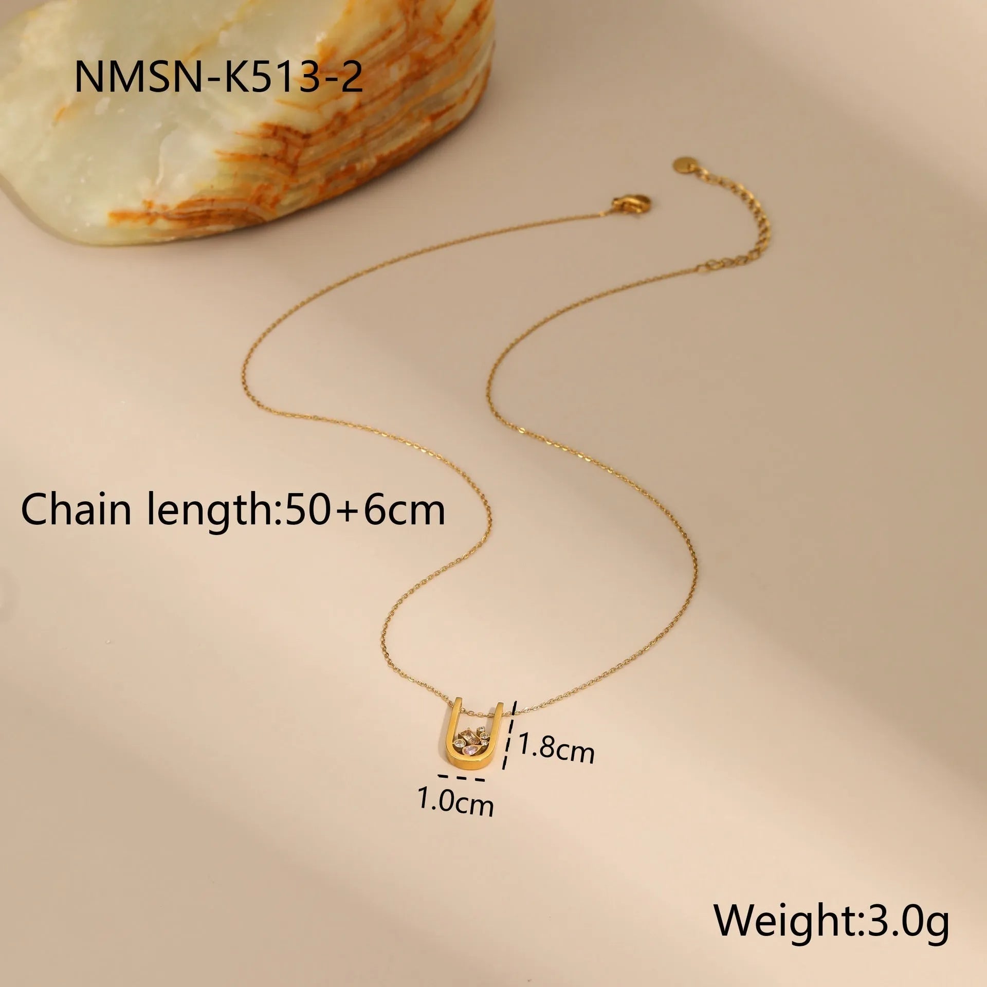 Geometric gold plated jewellery set with necklace, ring, and earrings on stainless steel chain