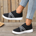 Black women's flat shoes with flyknit mesh upper and rubber sole