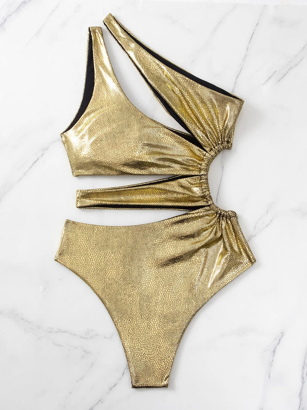 Women's gold backless one-piece swimsuit on hanger showing sleeveless design