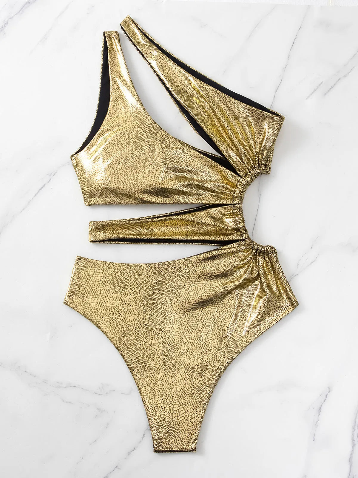 Women's gold backless one-piece swimsuit on hanger showing sleeveless design