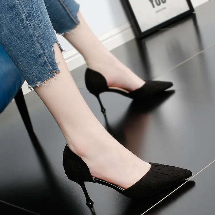 Women's black pointed toe stiletto high heels with a 6-8cm heel on a rubber sole.